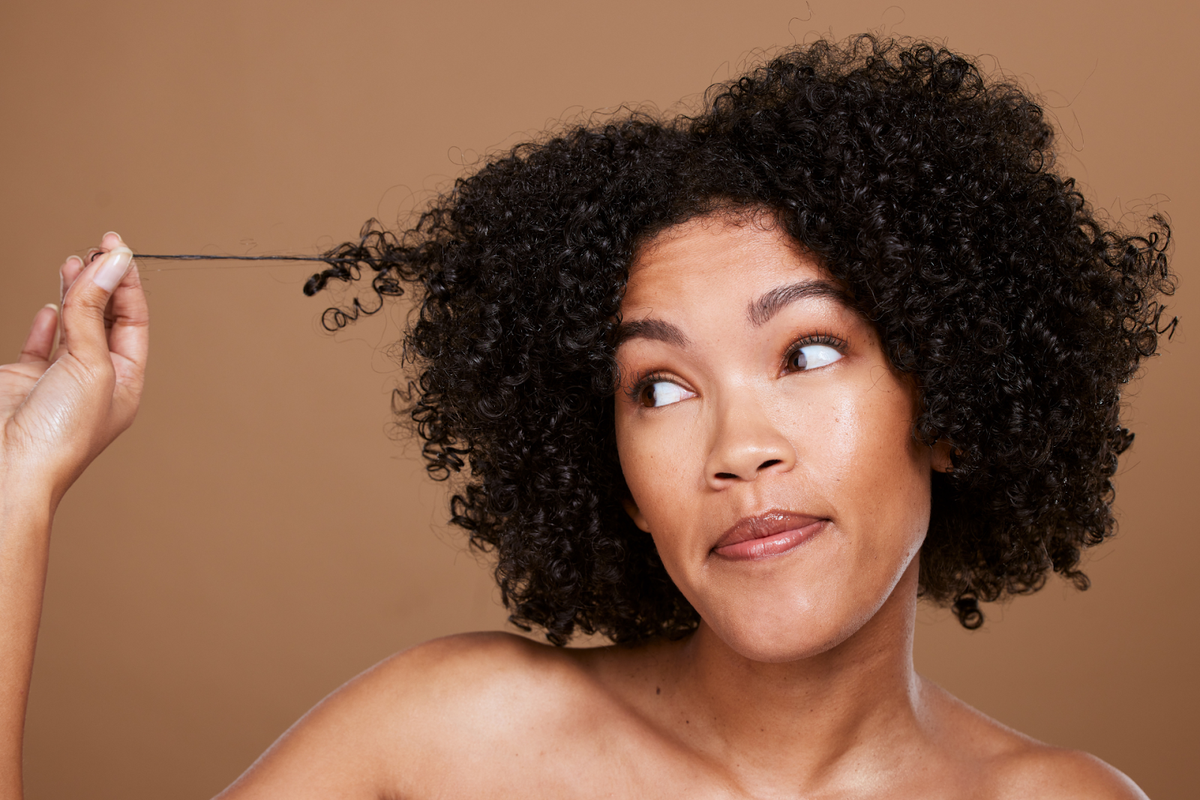 FullyVital black woman pulling hair