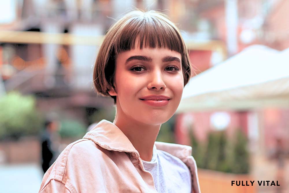 Short haired woman with baby bangs