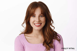 Smiling woman with curtain bangs with layers