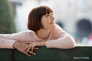 Woman with french bob with bangs looking up