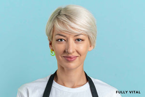 Smiling woman with long pixie cut