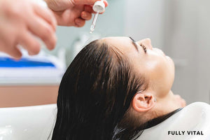 applying serum with hyaluronic acid on hair