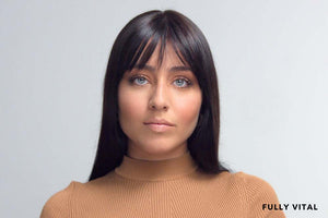 Blue eyed woman with wispy bangs