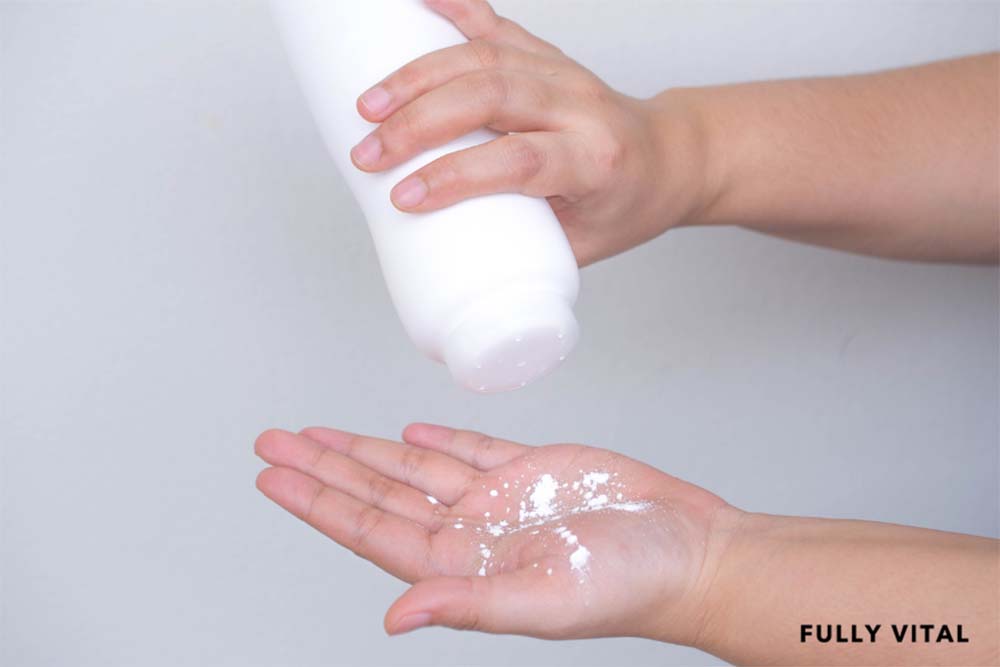 Pouring hair powder on hand